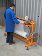 Operator cutting shrink film on the Ripack Multicover 960 E electric sealer