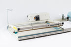 AIE L-bar shrink wrap system with film roll and separator, front view