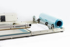 AIE L-bar shrink wrap system film rack with centerfold film roll, close-up