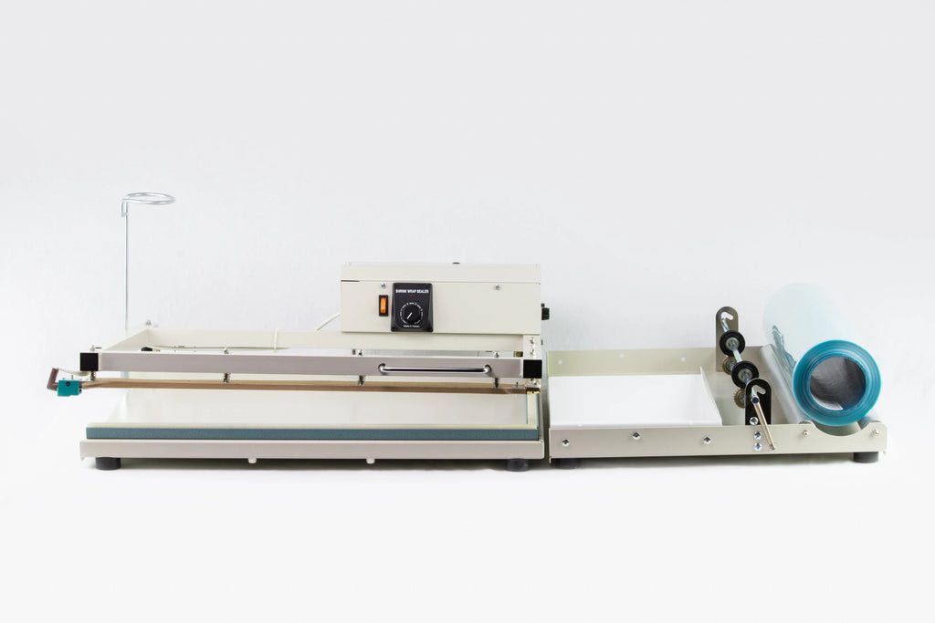 AIE L-bar shrink wrap system with centerfold film roll on the rack, side view