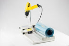 AIE-2040I 40-inch I-bar shrink wrap system, three-quarter view with heat gun