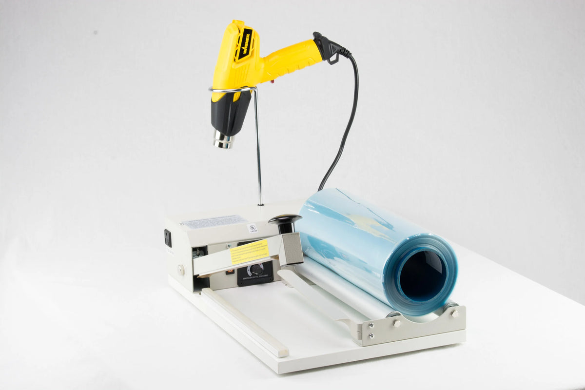 AIE-2040I 40-inch I-bar shrink wrap system, three-quarter view with heat gun