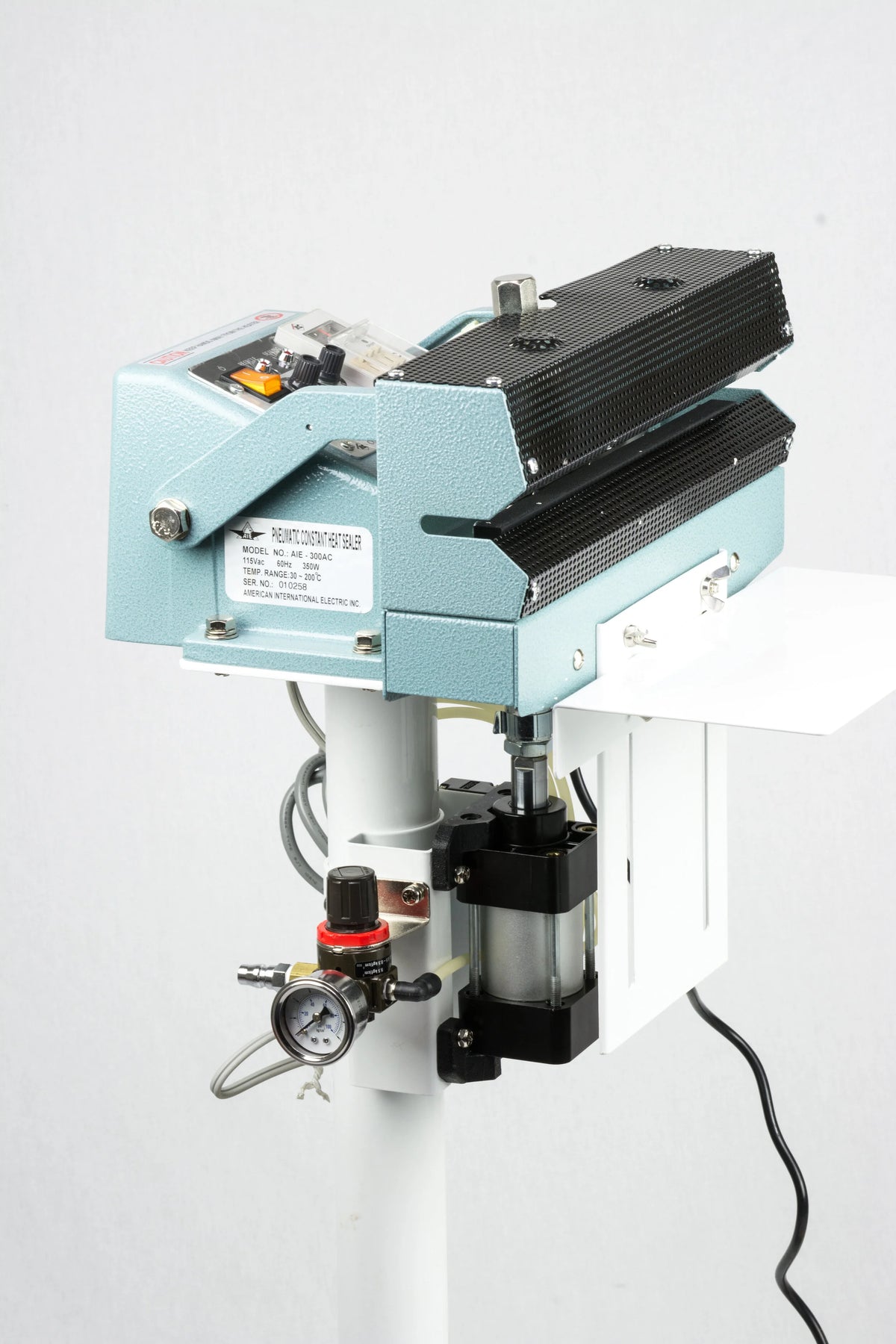 AIE AC Series pneumatic constant heat foot sealer sealing head and pneumatic cylinder, side view