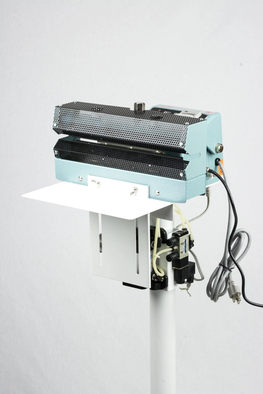 AIE AC Series pneumatic constant heat foot sealer mesh-textured jaws and work table, three-quarter view