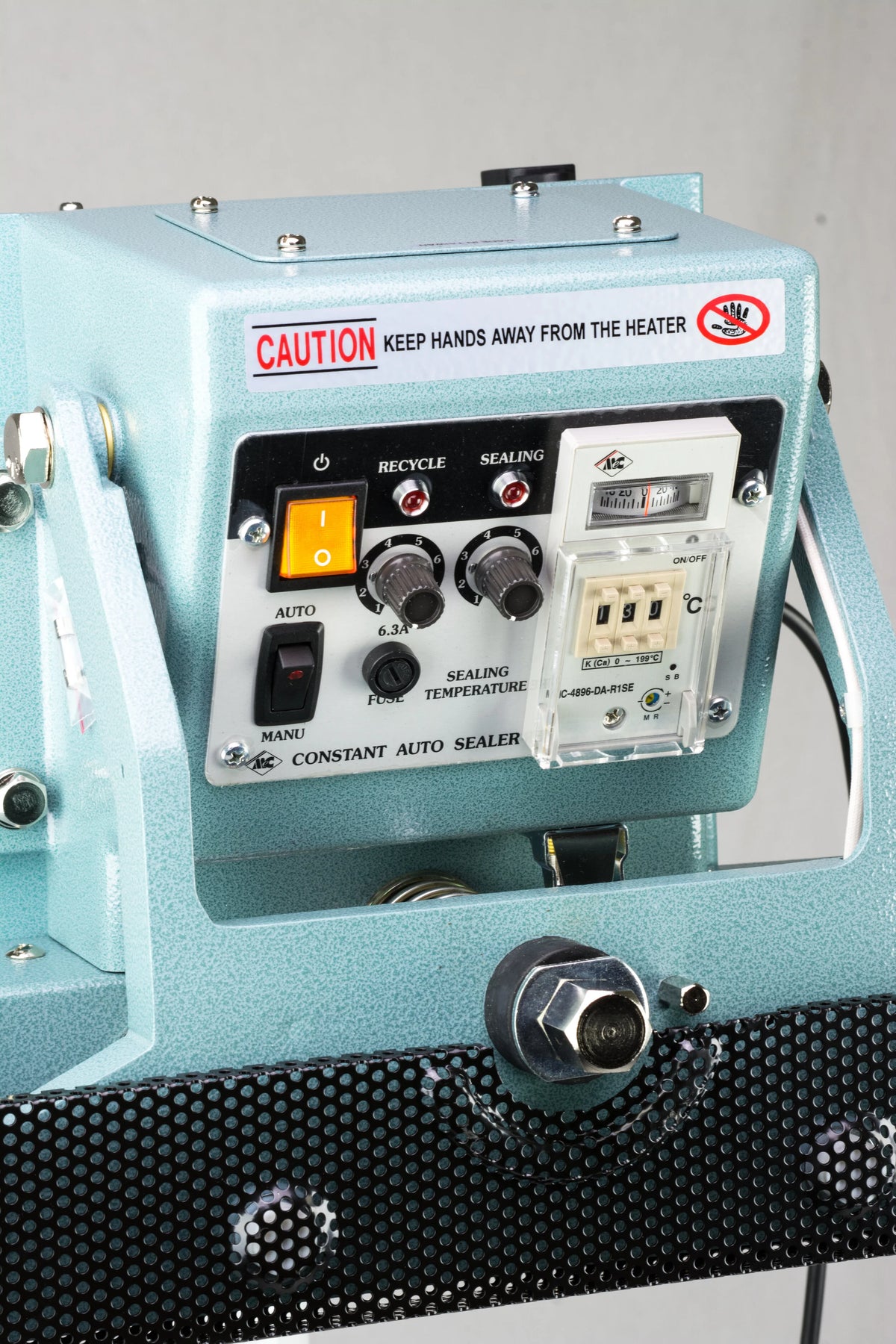 AIE CFV Series vertical constant heat foot sealer control panel with timer and temperature knobs, close-up