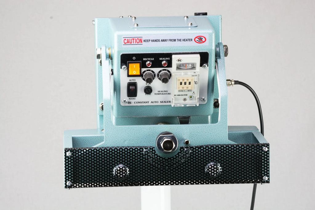 AIE CFV Series vertical constant heat foot sealer heated jaws and controls, close-up