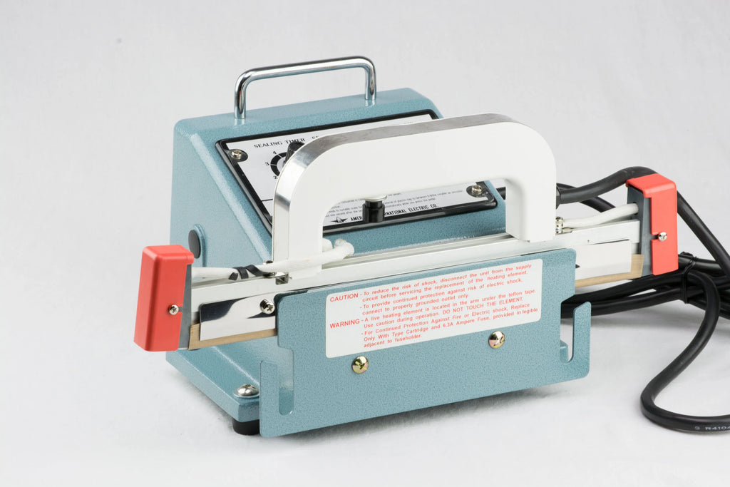 AIE-800PI portable I-bar shrink wrap system hand-held sealer resting on the controller