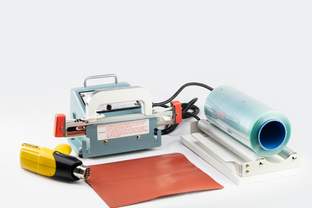 AIE-800PI portable I-bar shrink wrap system with hand-held sealer, heat gun and film roll
