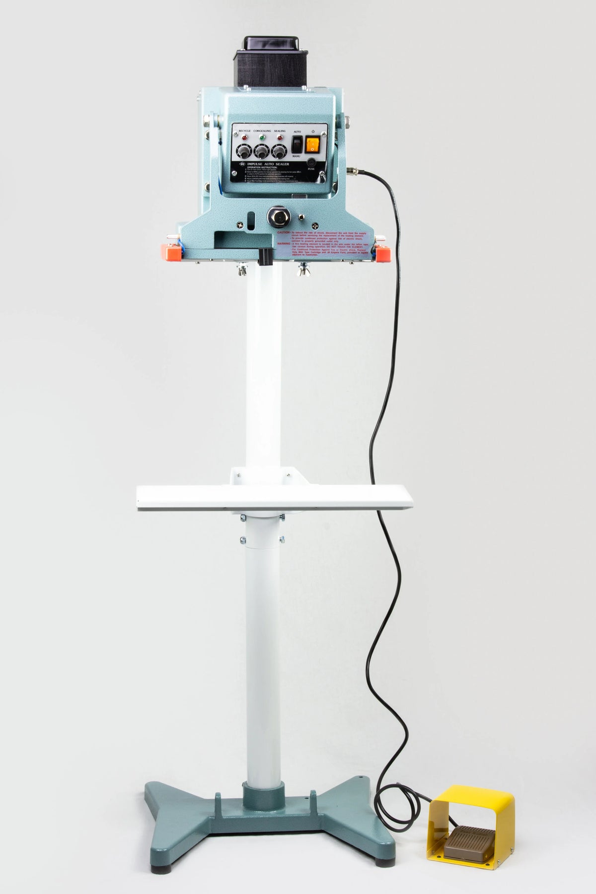 AIE FDV Series vertical double impulse foot sealer with work table and foot pedal, front view