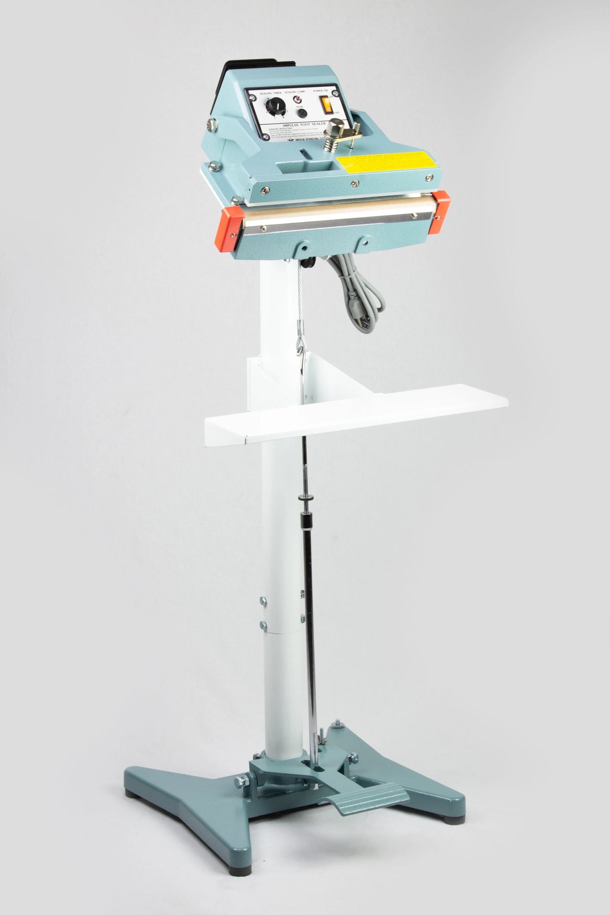 AIE FIT Series tilt angle impulse foot sealer on stand with heavy duty work table