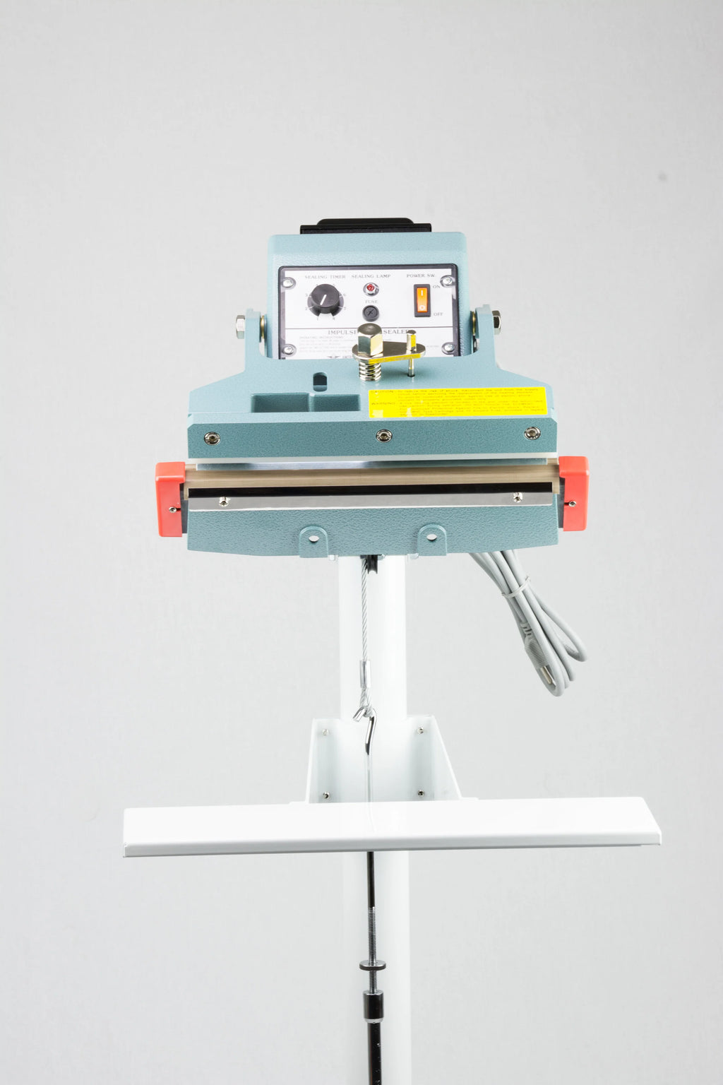AIE FIT Series tilt angle impulse foot sealer with work table, front view