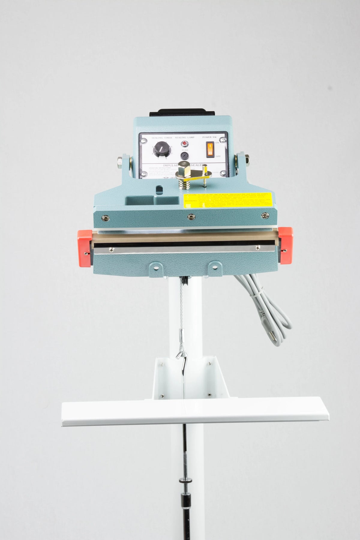 AIE FIT Series tilt angle impulse foot sealer with work table, front view