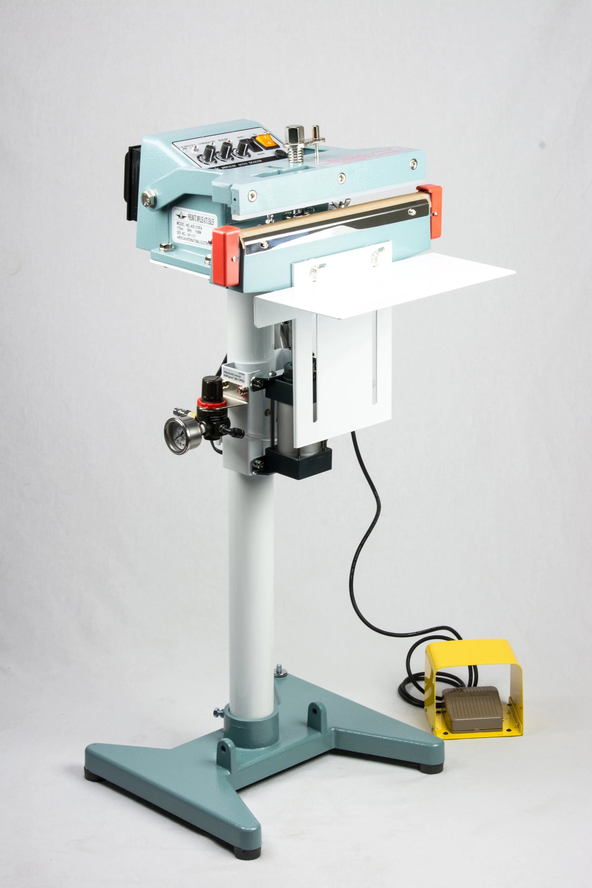 AIE FA Series pneumatic impulse foot sealer on stand with work table and foot pedal