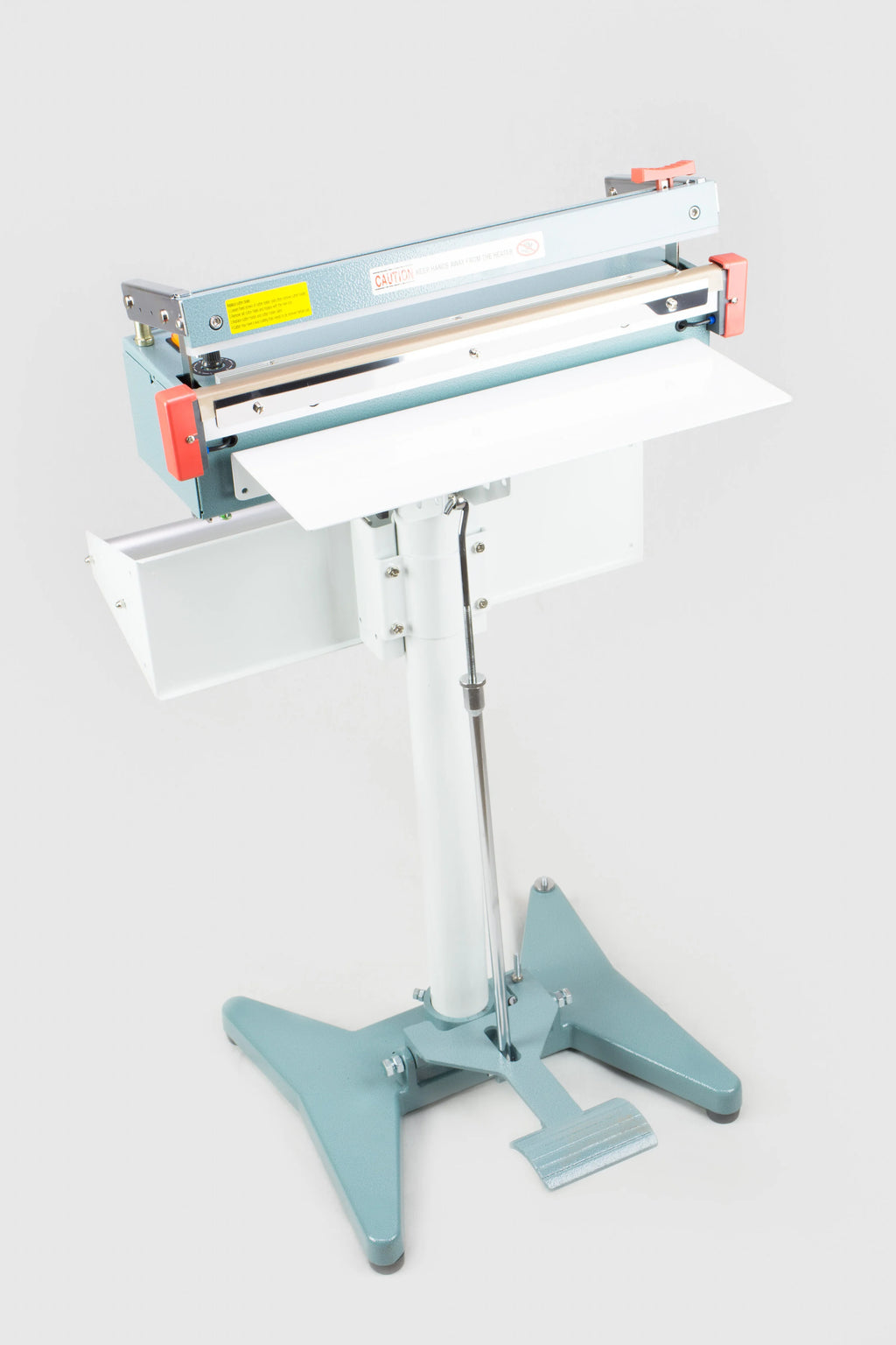 AIE FC Series impulse foot sealer with trimmer on stand with work table