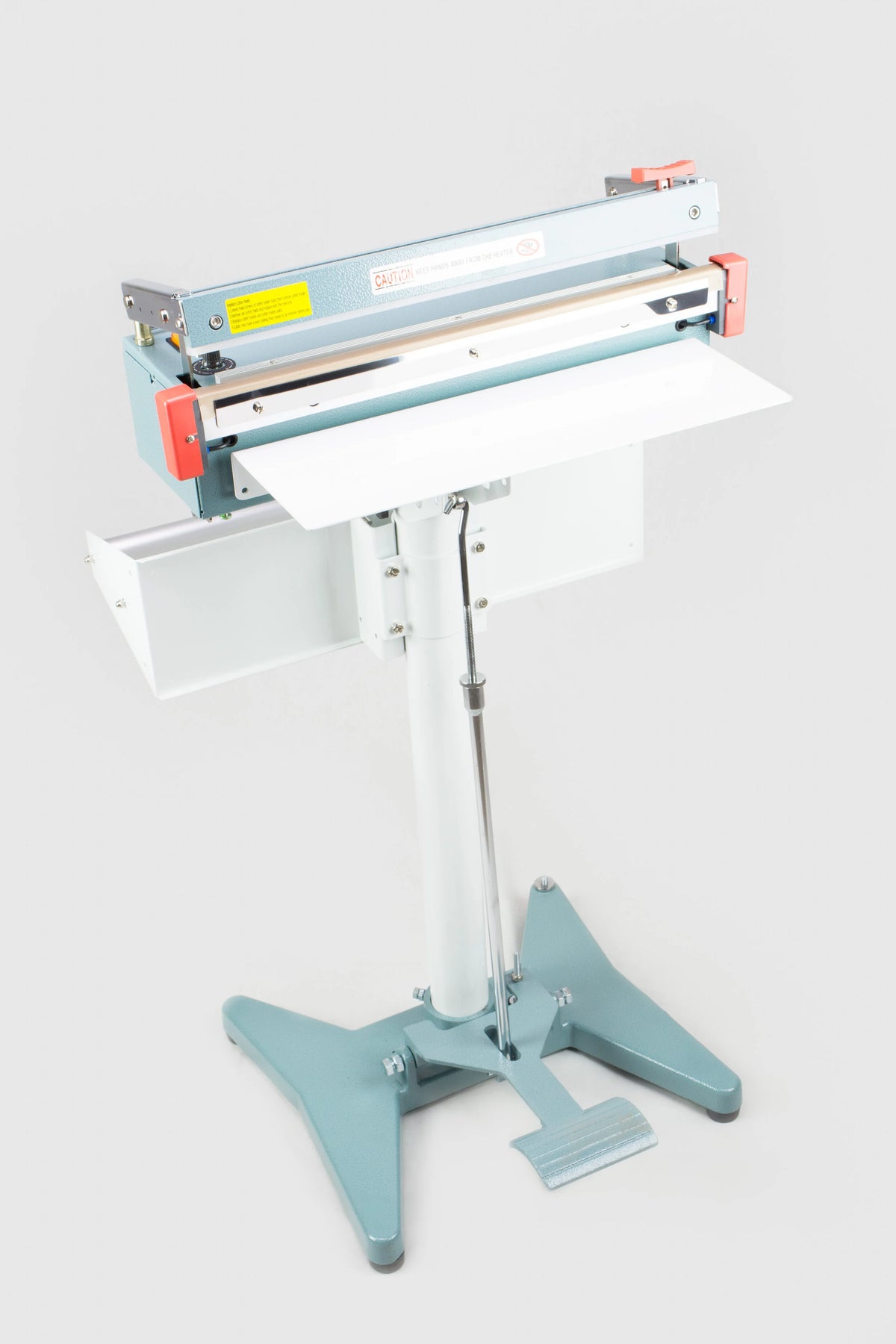 AIE FC Series impulse foot sealer with trimmer on stand with work table