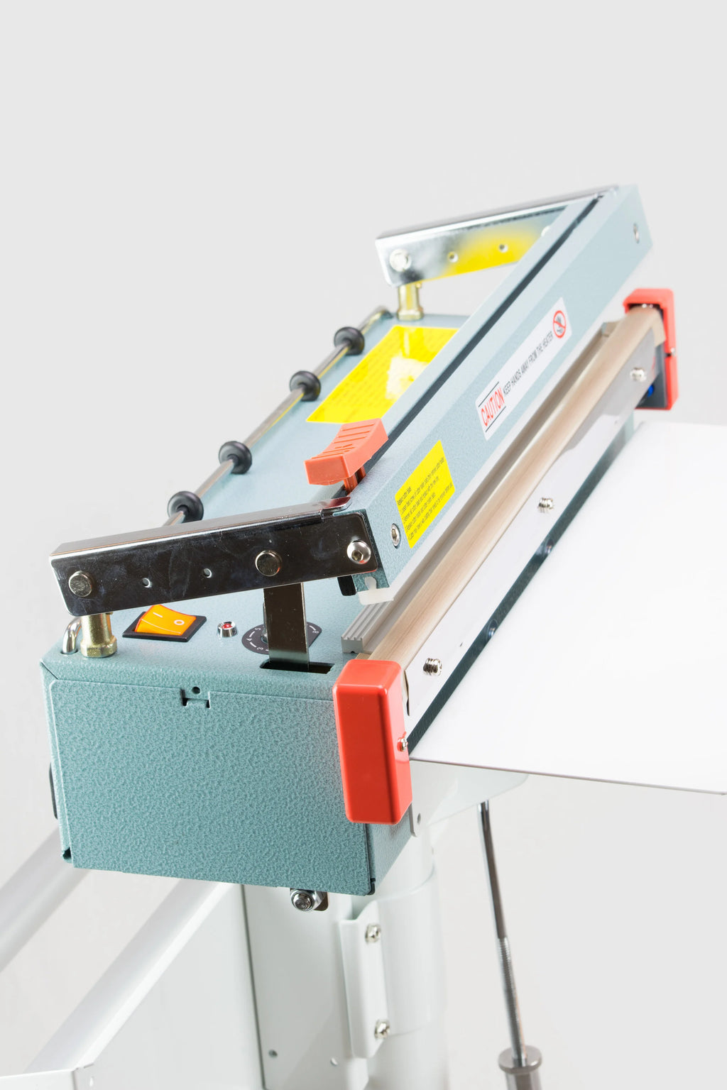 AIE FC Series impulse foot sealer with trimmer sliding trimmer and seal bar, close-up