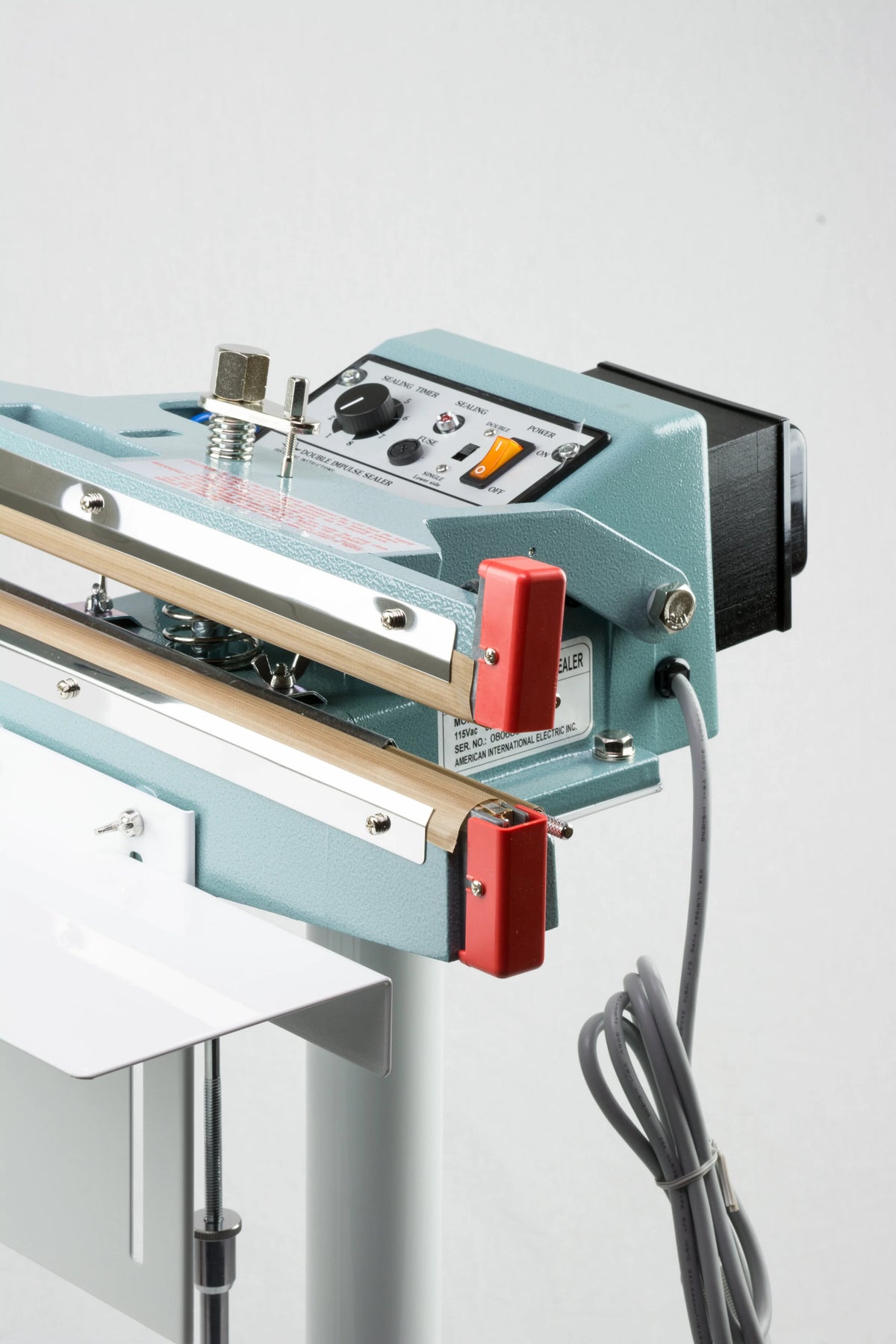 AIE FD Series double impulse foot sealer control panel and heated jaws, close-up