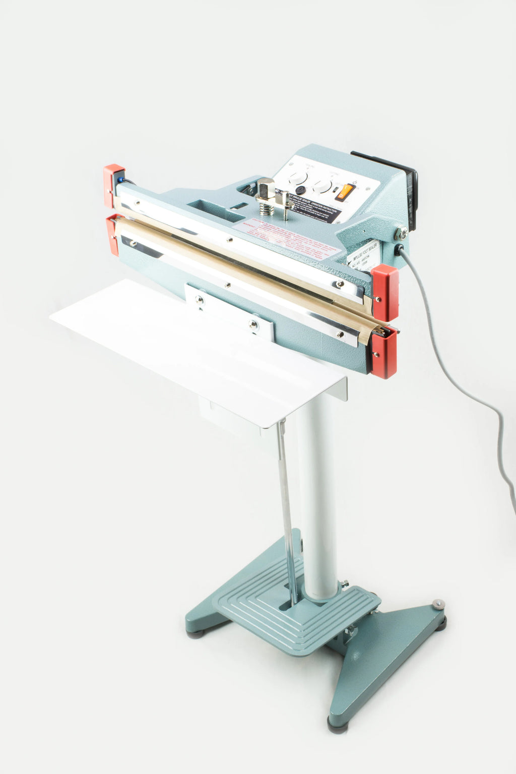 AIE600FDC 24-inch double impulse seal and trim foot sealer on stand with work table