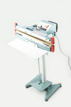 AIE600FDC 24-inch double impulse seal and trim foot sealer on stand with work table