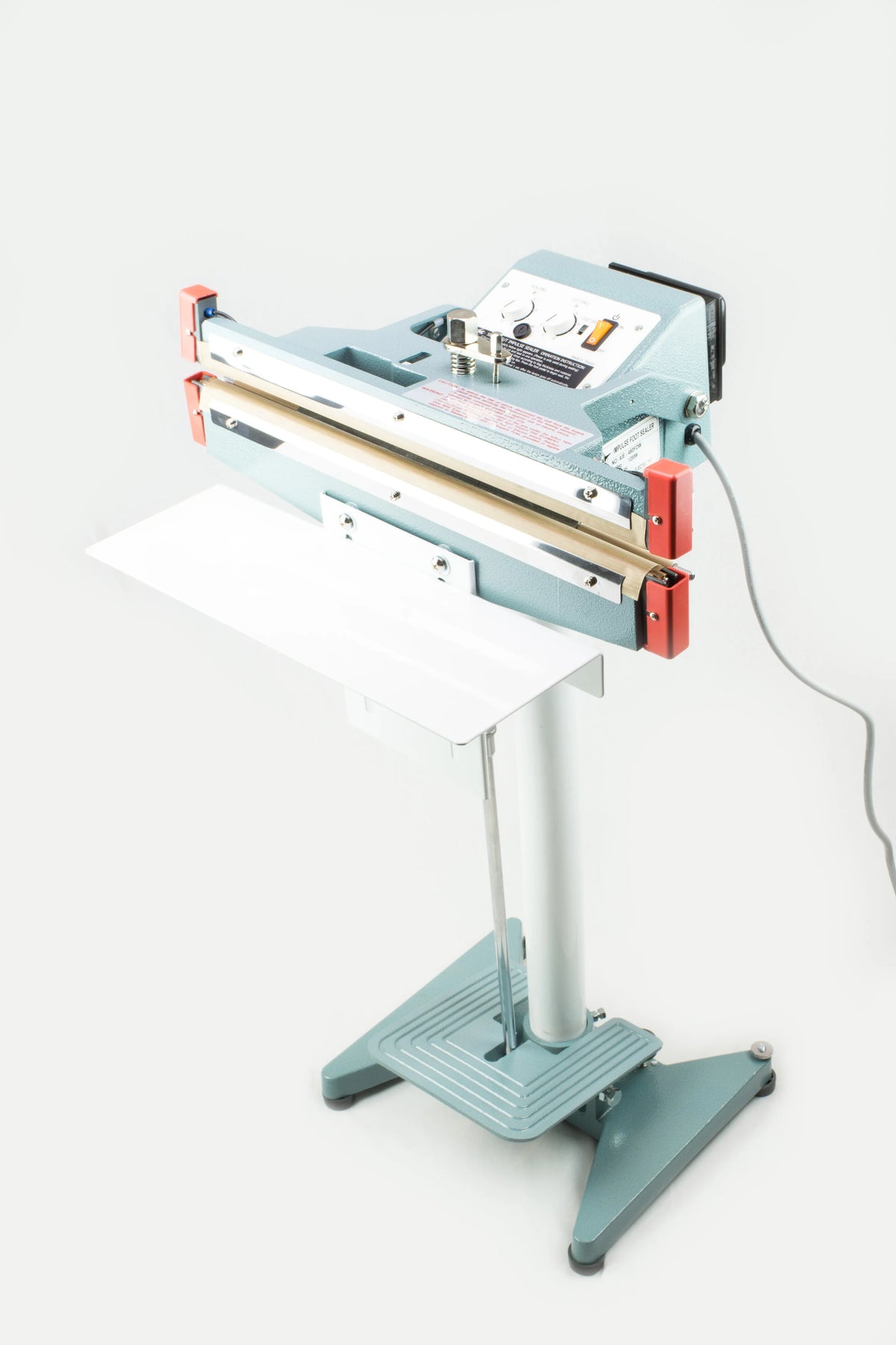 AIE600FDC 24-inch double impulse seal and trim foot sealer on stand with work table