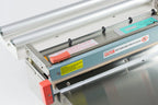 AIE455FCE stainless steel digital impulse sealer with trimmer sealing jaws and blade guard, close-up