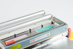 AIE455FCE stainless steel digital impulse sealer with trimmer trimming area, close-up