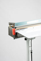 AIE FS Series stainless steel sealing head and work table, close-up