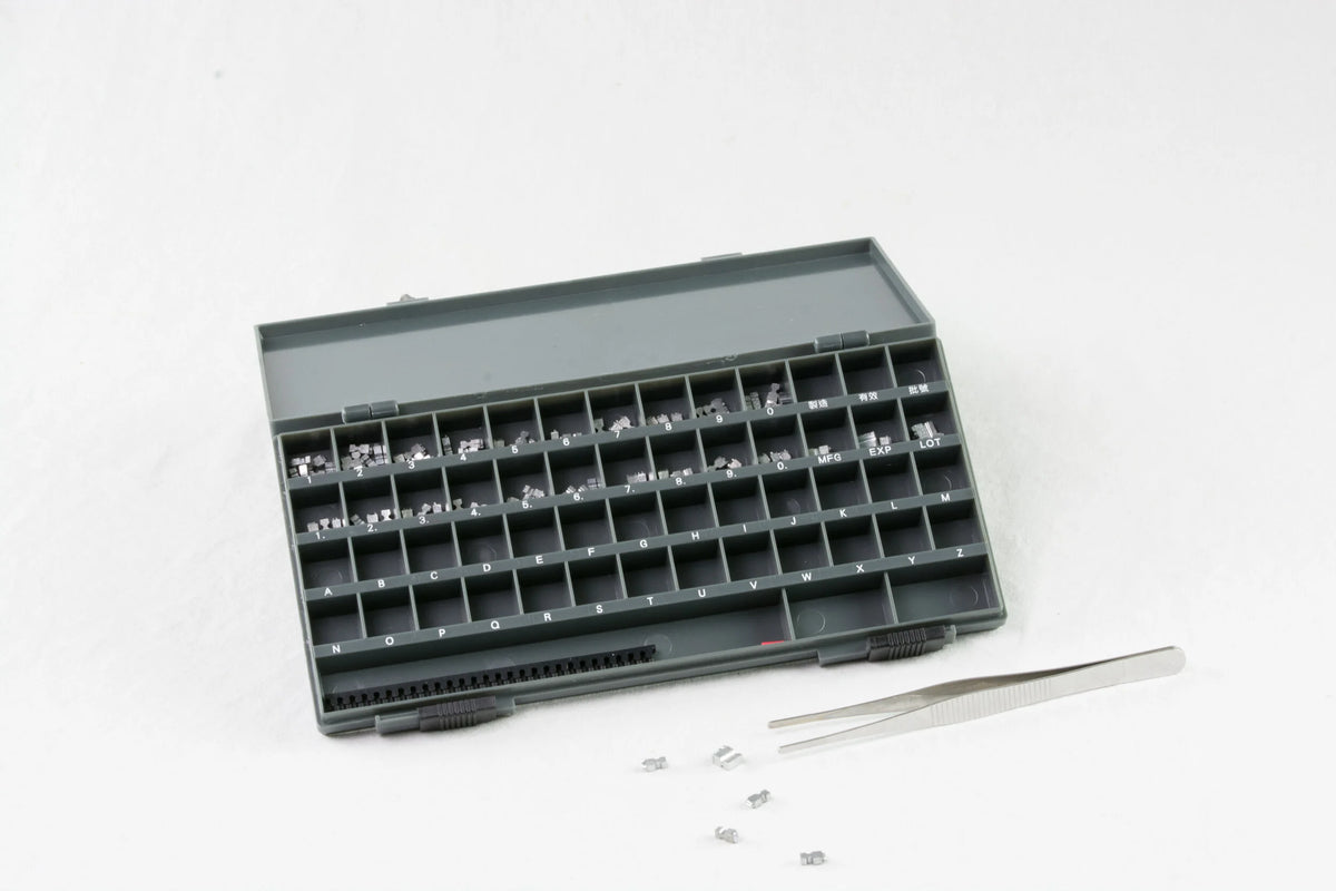 AIE-663 imprinter type set in its case with tweezers