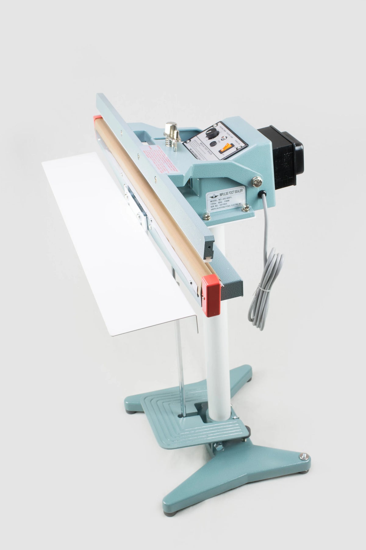 AIE FL Series impulse foot sealer with long seal bar and foot pedal, side view