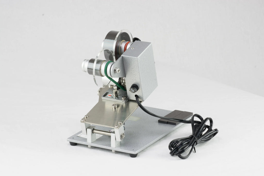 AIE DHH 3-line manual hot stamp imprinter on its base plate, angled view
