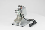AIE DHH 3-line manual hot stamp imprinter on its base plate, angled view