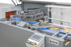 Maripak CLS Compact sealing area, touchscreen and conveyor with products in film