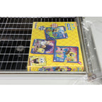 Shrink-wrapped game box on the mesh tray of the Maripak Compack 5800i