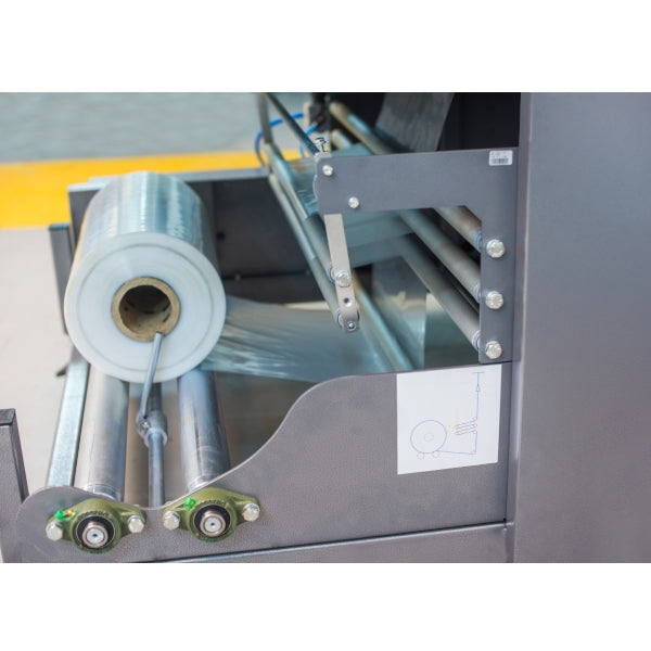Maripak Multimac D 80 PE film roll and motorized film drive rollers, close-up