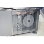 Maripak Pro-MOTION series film unwind and trim winder behind the side door (shown for the WRAPTURE Pro-MOTION 40)
